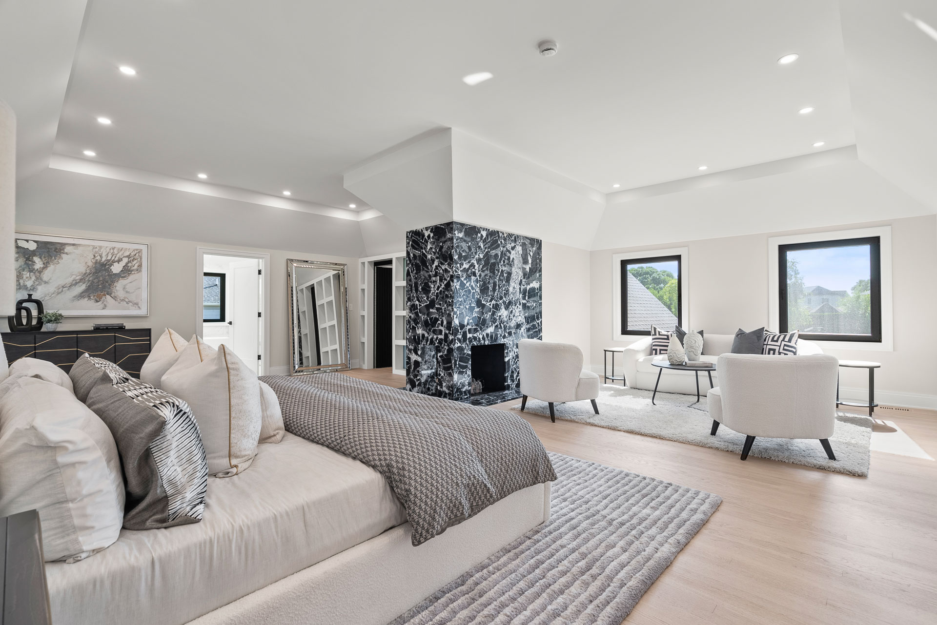 Bedroom remodeling by Berno Renovations with updated flooring, walls, lighting, trim, and modern finishes